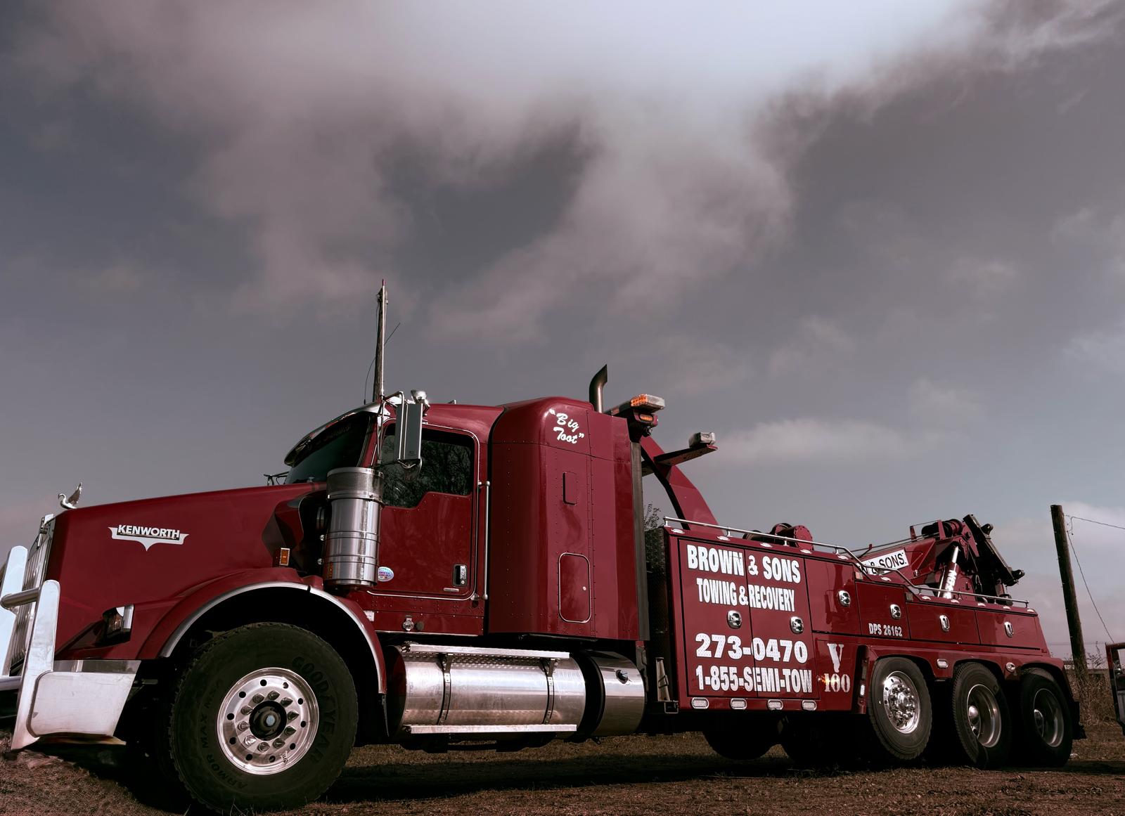 Brown & Sons Kenworth heavy duty wrecker Big Foot under a stormy sky