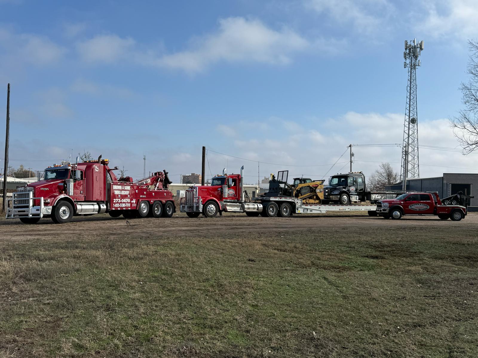 Brown & Sons heavy wreckers, Landoll flatbed and rollback trucks lined up in Shawnee, Oklahoma